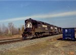 NS 7004 leads a train southbound